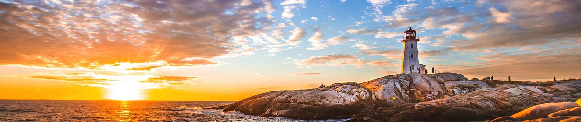 Peggy's Cove Lighthouse at sunset on the Atlantic coast of Nova Scotia, Canada